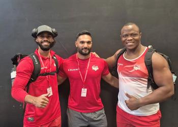 Weightlifters pose for a picture