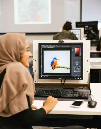 A design student at a computer