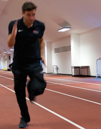 A man runs along a track