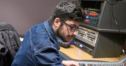 Student using a sound mixer