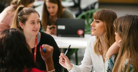 Staff and students chatting