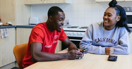 students talking in kitchen