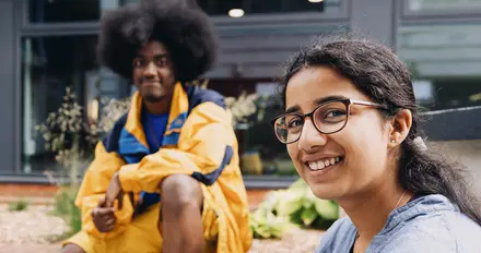 Two students sat on campus