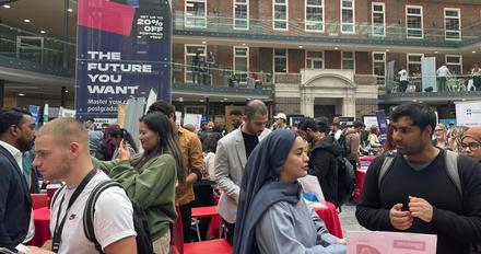 Lots of people in a building at a careers event