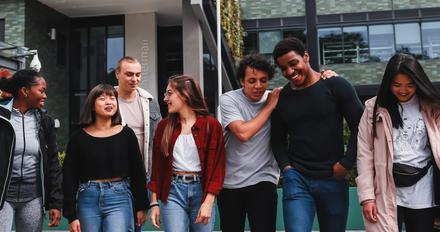 Group of students walking outside on campus.