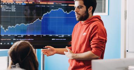 A student presenting financial data