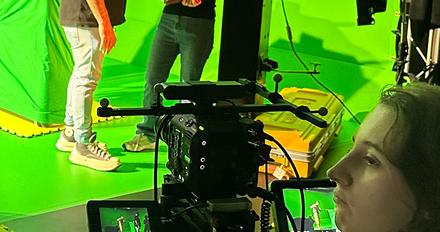 Students filming using green screen technology