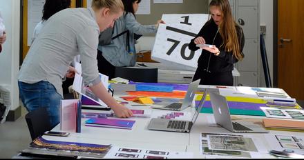 A diverse team collaborating on a project, brainstorming ideas and working together towards a common goal.