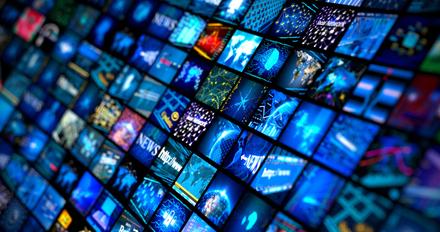 A large panel of small media screens