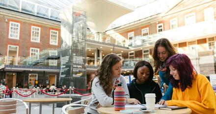 A group of students sitting at a table studying