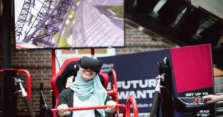 student sits in VR rollercoaster