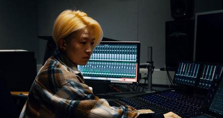 Music student using mixing equipment