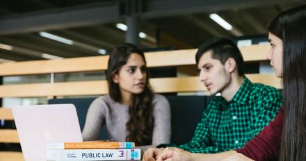 Law students studying in library.