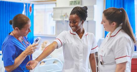 Students working in midwifery ward.