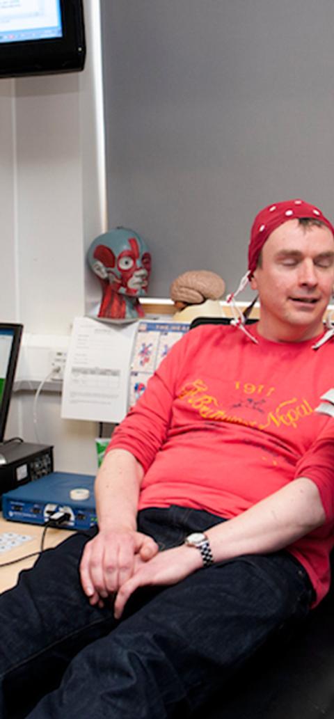 A man having applied psychology ECG tests in lab