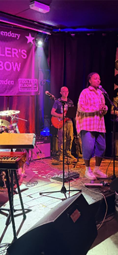 Students on stage performing at music.