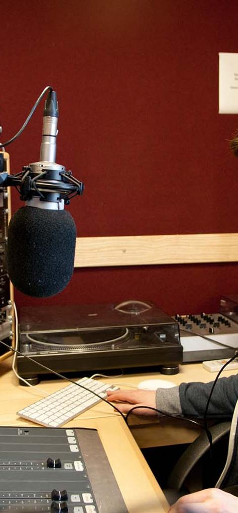 Student in radio studio.