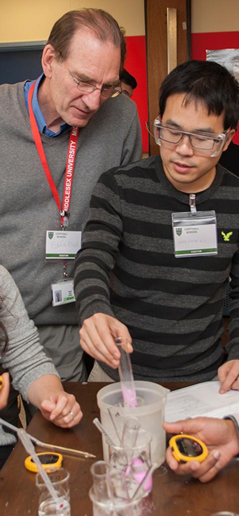 A lecturer and students in a lab
