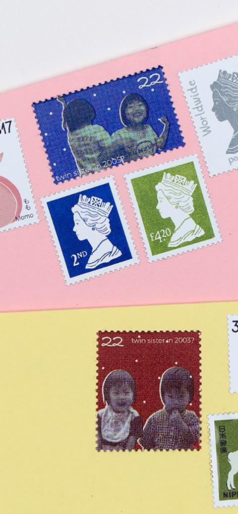Two envelopes, one pink and one yellow with stamps