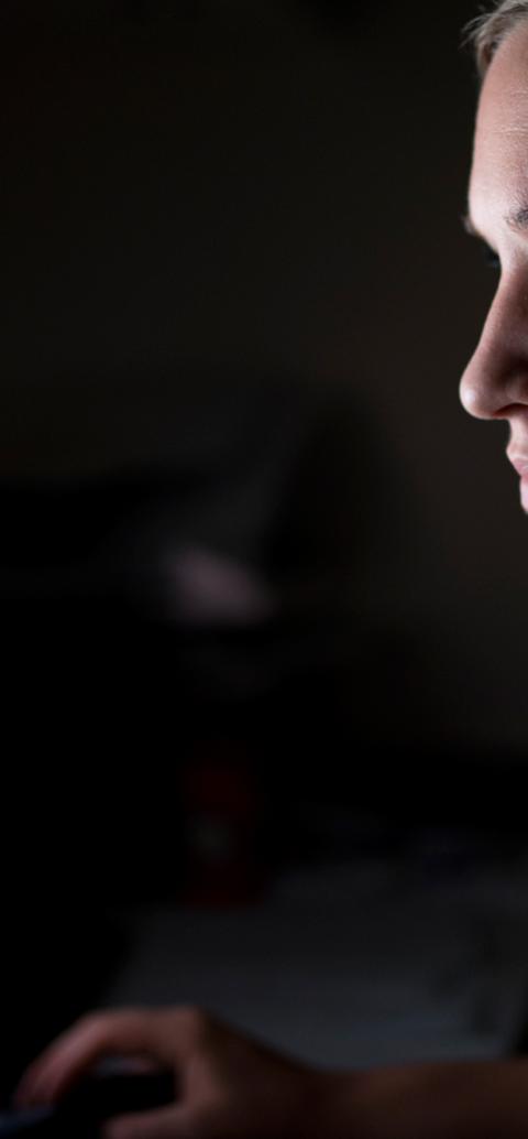 woman reading something from a computer screen