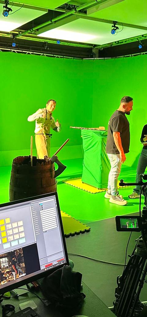 Students filming using green screen technology