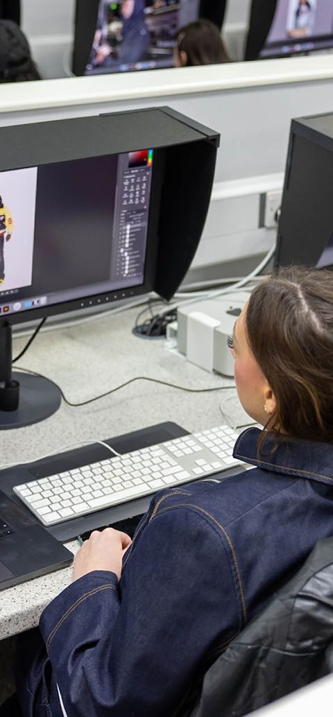 Students editing images on computer