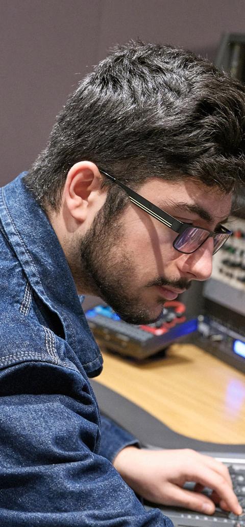 Student using a sound mixer