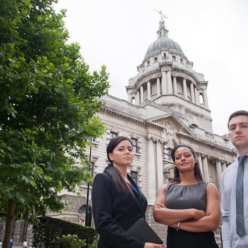 Three law students outside the Royal Courts of Justice