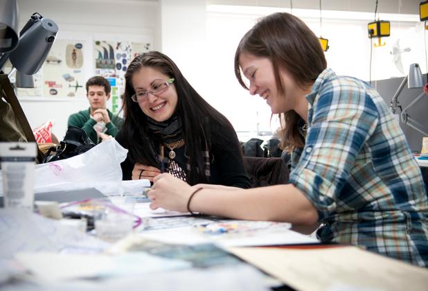 Art and design students work together on a creative project in a university studio