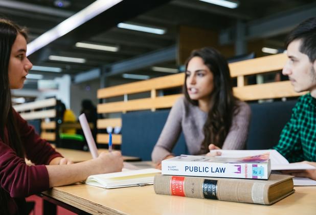 LLM students discuss legal concepts and case materials during a collaborative seminar session
