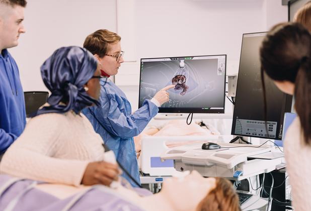 Medical physiology students examine diagnostic images during a practical session in a clinical teaching laboratory.