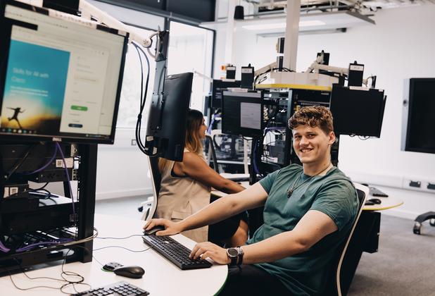 Students work on digital design projects in a university computer laboratory.