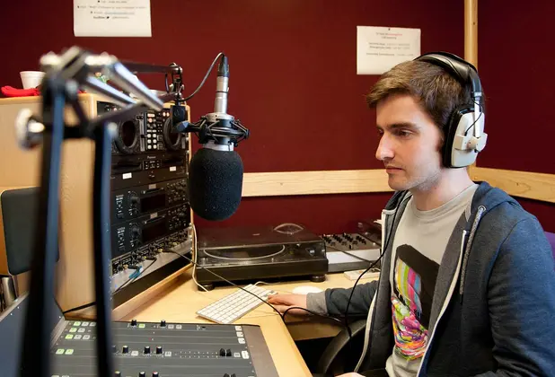Student in radio studio.