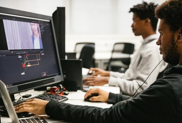 A student designing a game on the computer