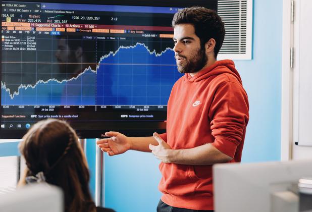 A student presenting financial data