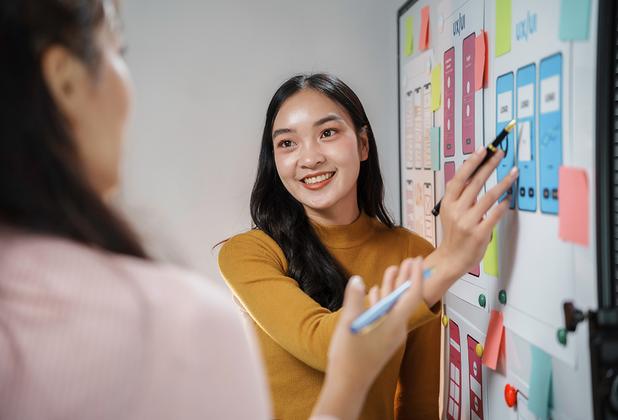 A student visually explaining something to another student
