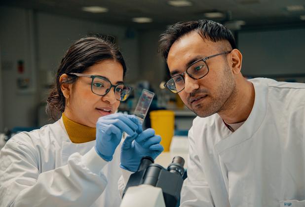 Female and male student testing in a lab