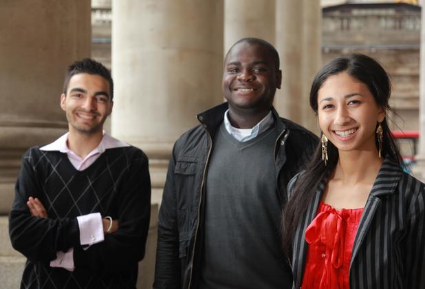 Three students standing outside the Bank of England