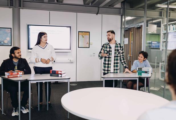 Students debating in a study room