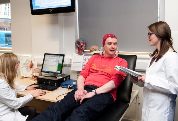 A man having applied psychology ECG tests in lab
