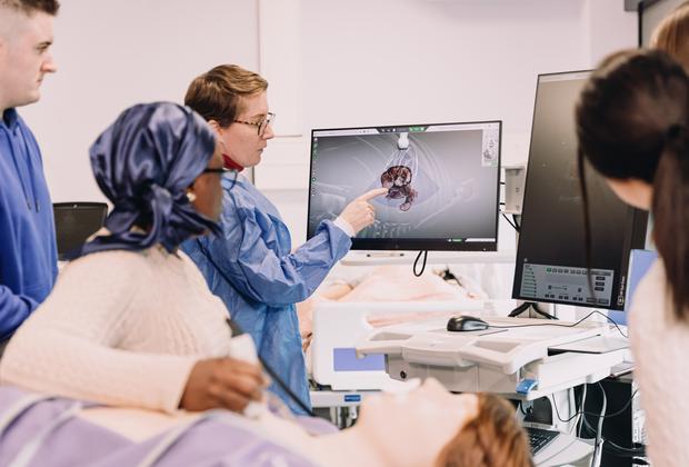 Medical physiology students examine diagnostic images during a practical session in a clinical teaching laboratory.
