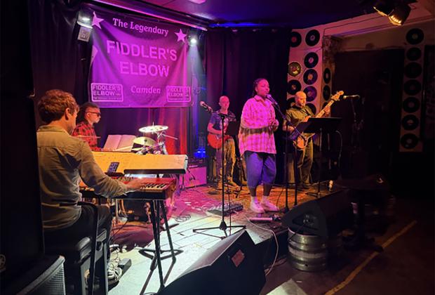 Students on stage performing at music.