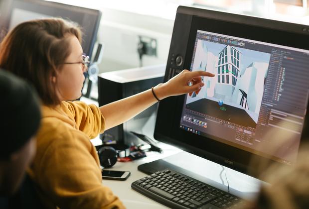 Animation students create and review a 3D digital environment using professional design software.
