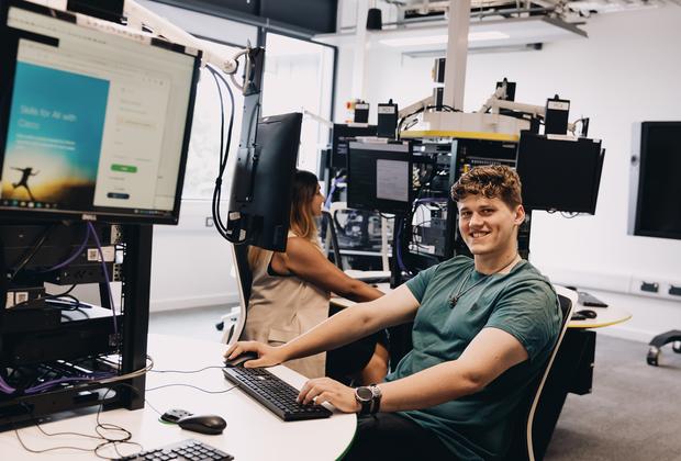 Students work on digital design projects in a university computer laboratory.