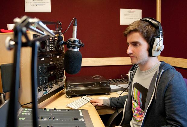 Student in radio studio.