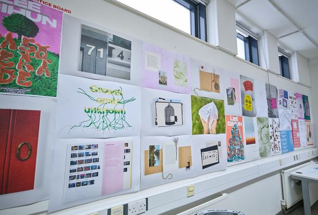 Two students in a computer lab, working on computers