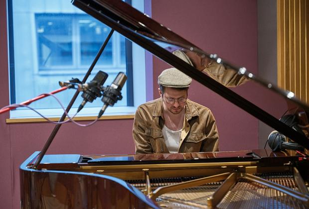 Music production set up alongside speakers and headphones