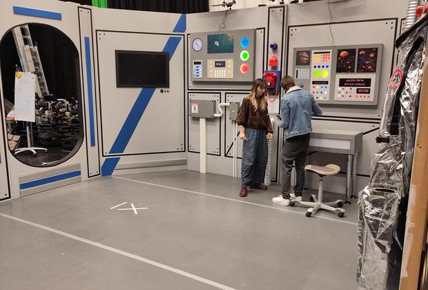 Two MA Production Design students working on a set layout