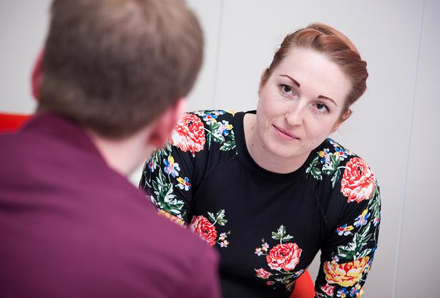 a man faces a woman with a questioning look