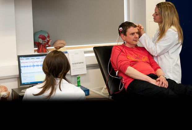 student doctor examining a patient's mind